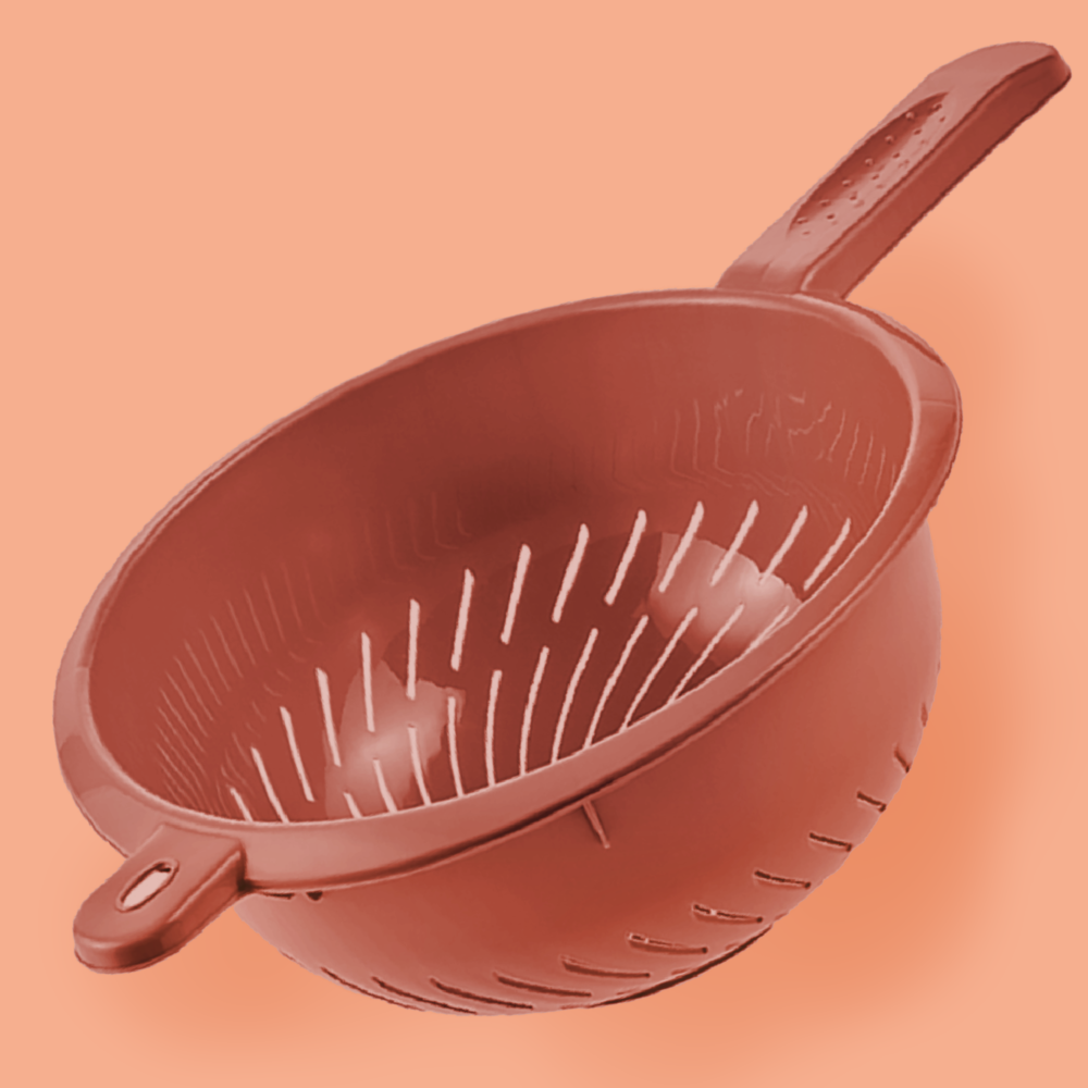 Terracotta-colored plastic colander ''fabio'' with side handles and drainage slots, shown on a matching background.