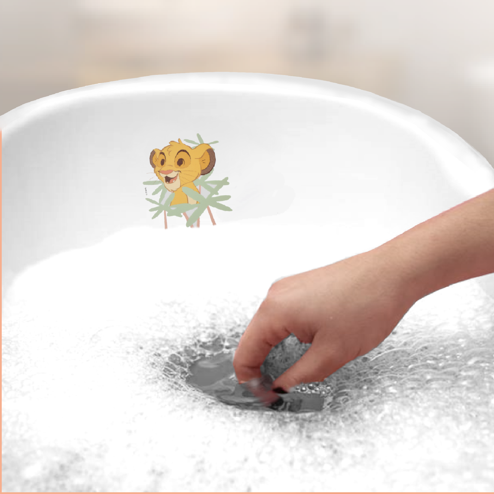 Baby bathtub ''maria'' filled with foam and playful lion illustration.